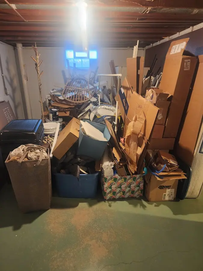 Roll-off dumpster container at job site for 8 Yard Dumpster Rental in Lee